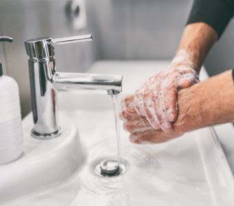 Washing hands rubbing with soap