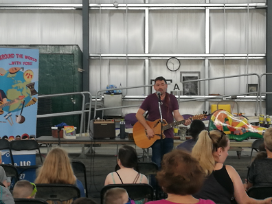 Children's preformer, Yosi, playing his guitar