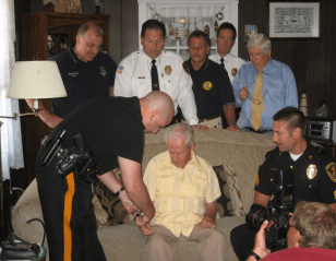 Placing GCSO Project Lifesaver Bracelet on Citizen
