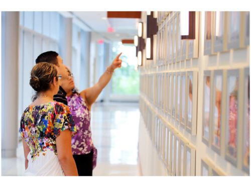 People looking at Wall of Heroes
