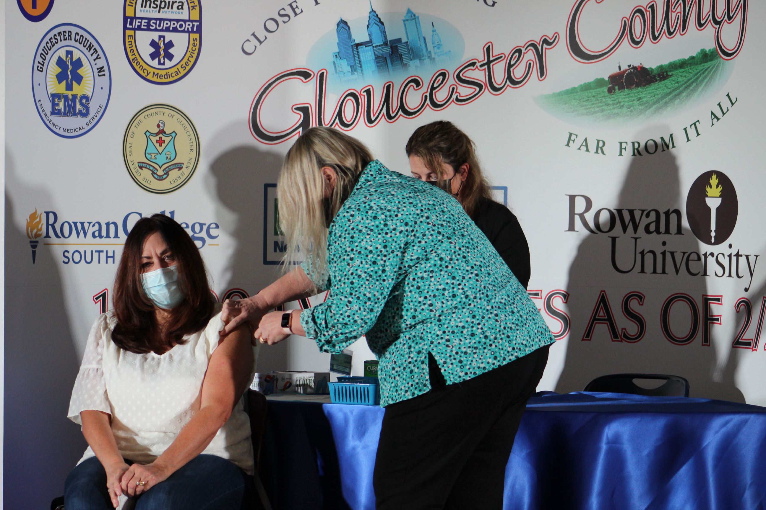 Dittmae Jankauskas, Gloucester County Director of Nursing, administers the honorary 100,000 vaccinat
