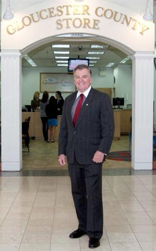Clerk James Hogan in front of the County Store